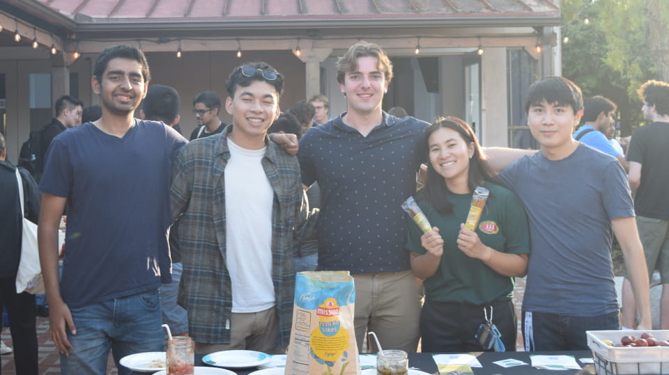 UCI student entrepreneurs standing in the UCI ANTrepreneur Center courtyard during a Taco Mixer event.