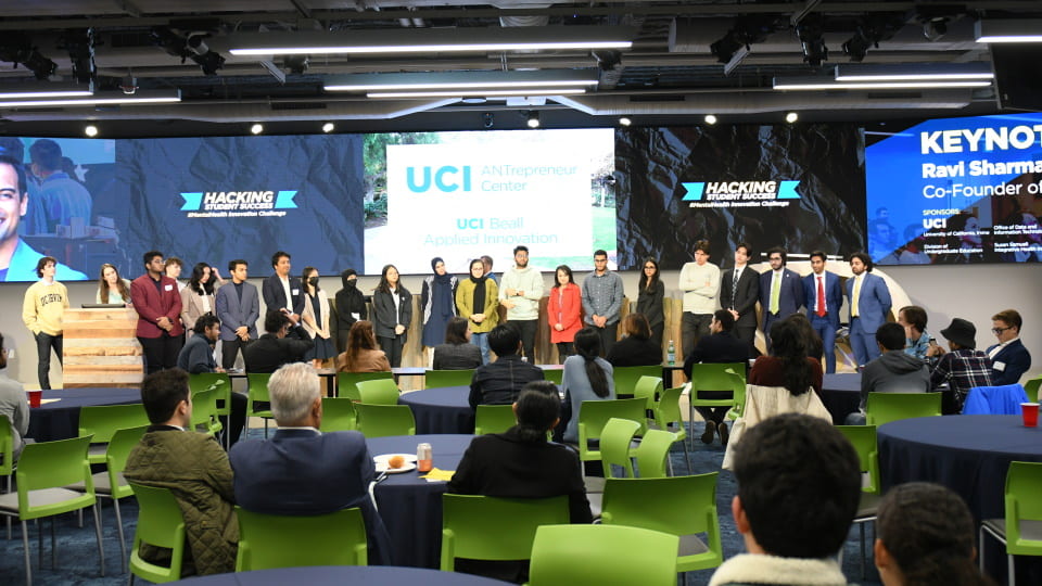 Student finalist teams standing on the stage at the finale of the UCI ANTrepreneur Center Mental Health Hackathon.